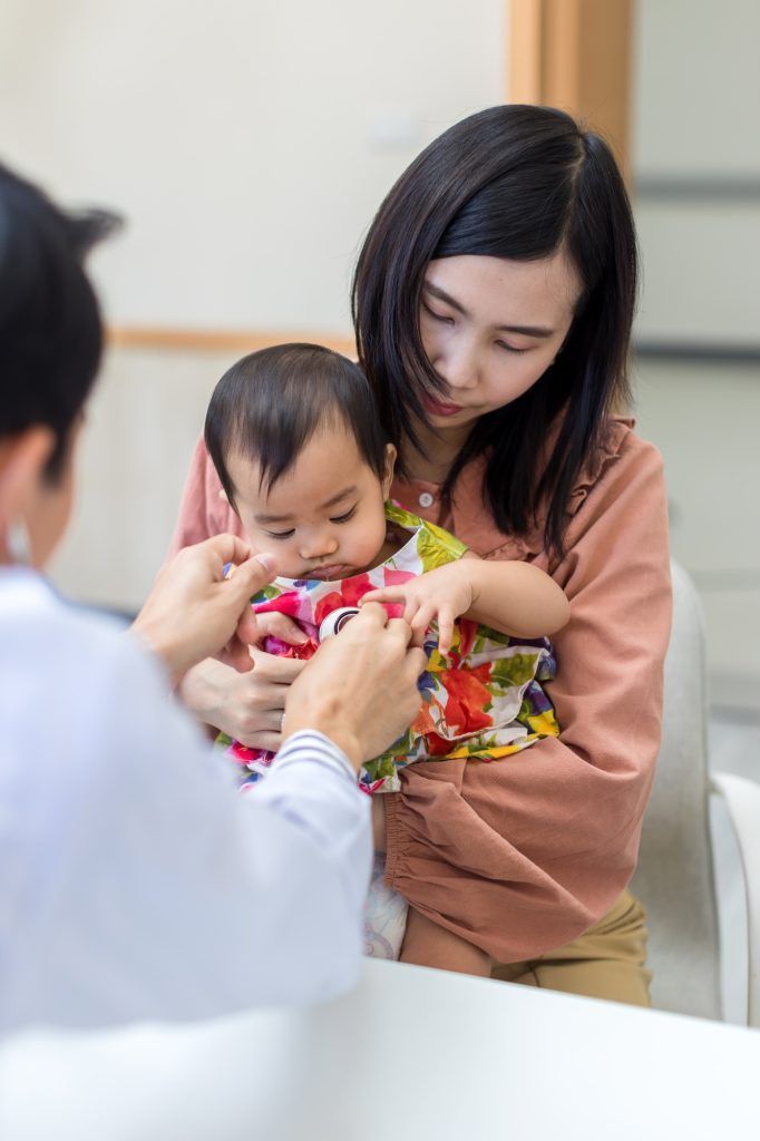 baby being checked by a doctor using a stethoscope. Pediatrician doctor prepare for examines baby wi